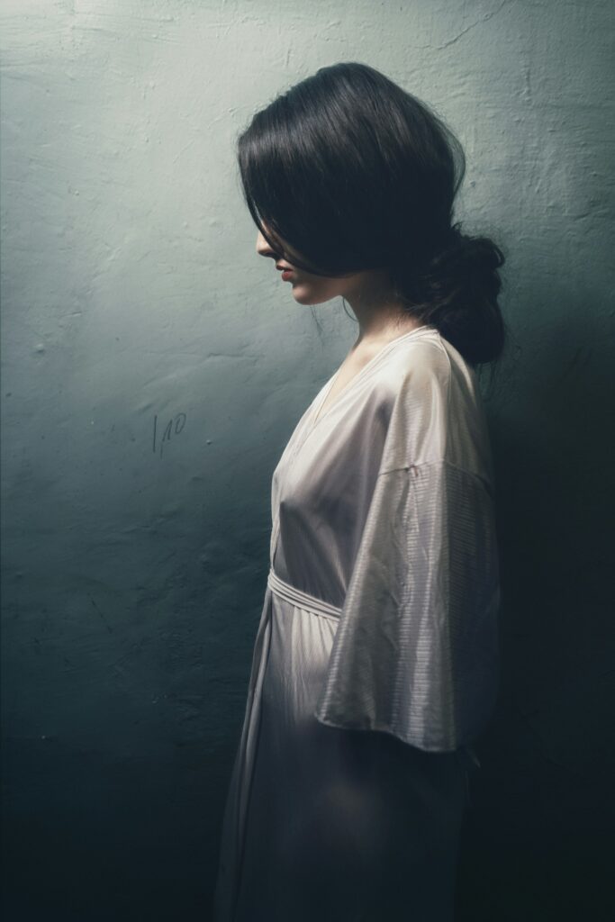Side profile of a woman looking distressed