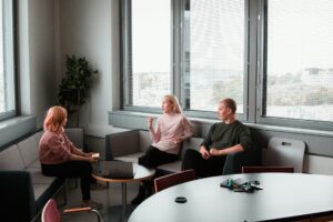 2 women sitting on black sofa for therapy